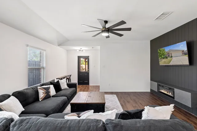 a living room with furniture and a window