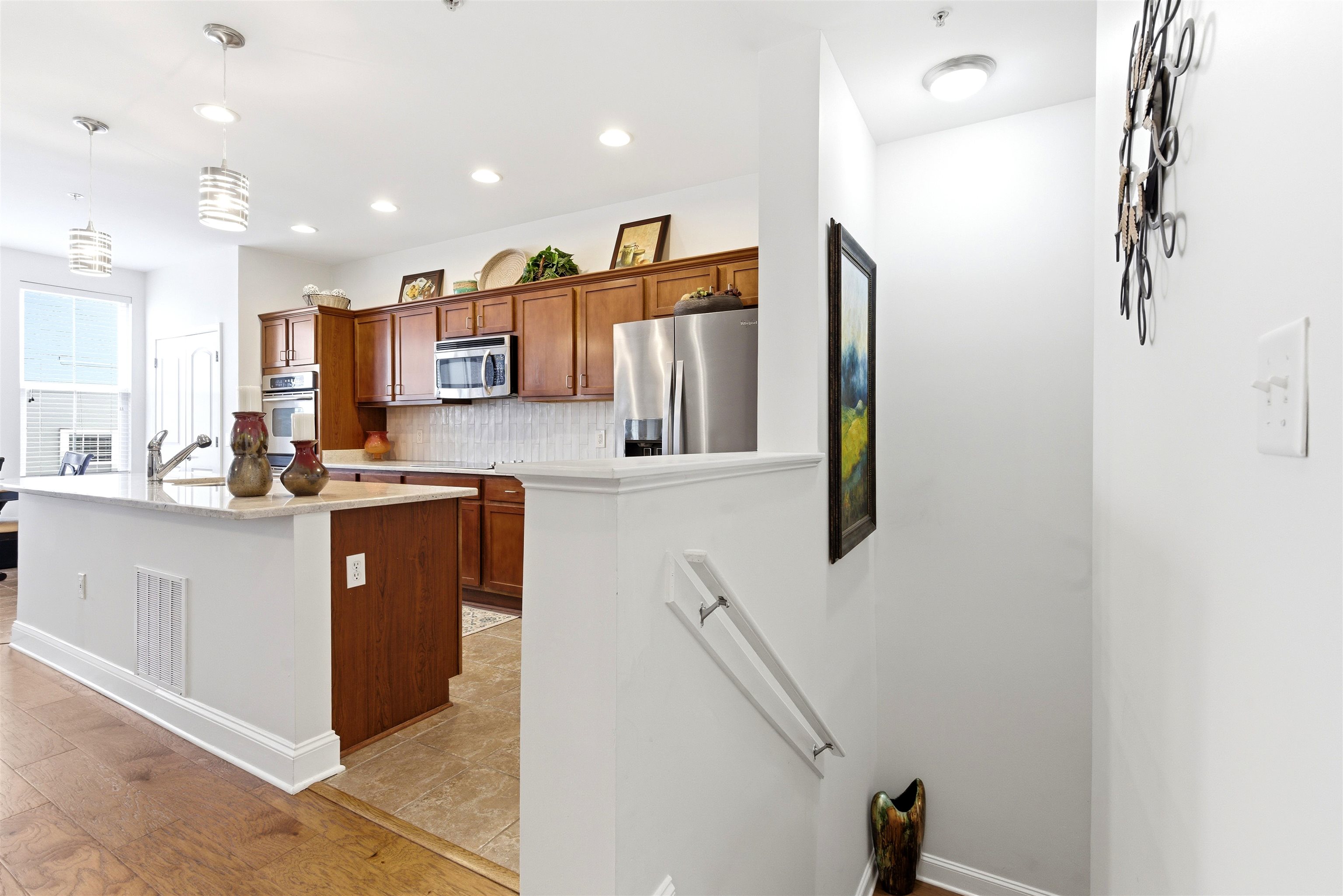 75 Shoemaker Court, Unit 105 Memphis, TN 38103 - Photo 14 of 36 a kitchen with stainless steel appliances granite countertop a refrigerator and a sink