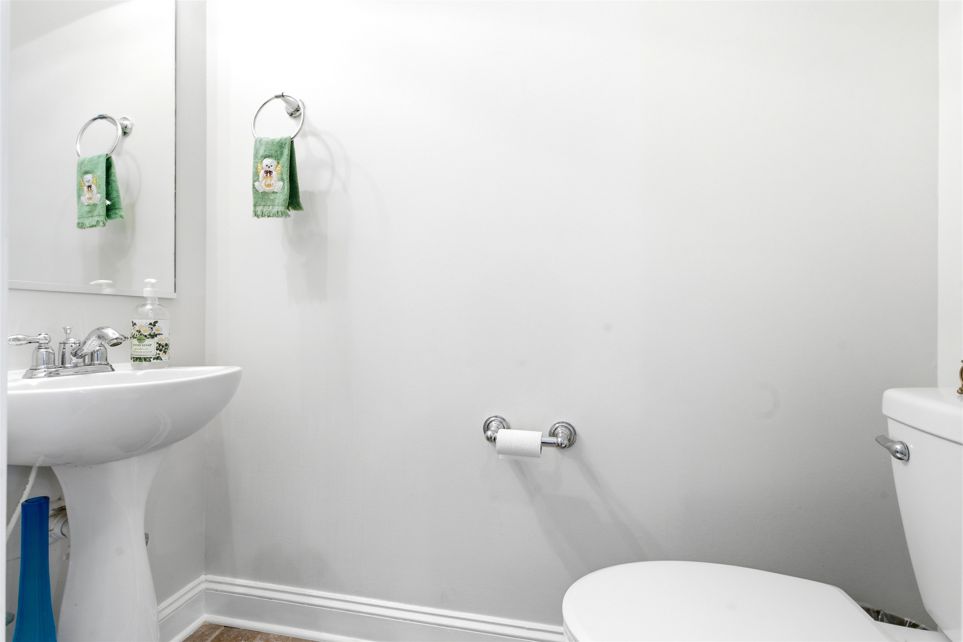 75 Shoemaker Court, Unit 105 Memphis, TN 38103 - Photo 15 of 36 a bathroom with a toilet a sink and mirror