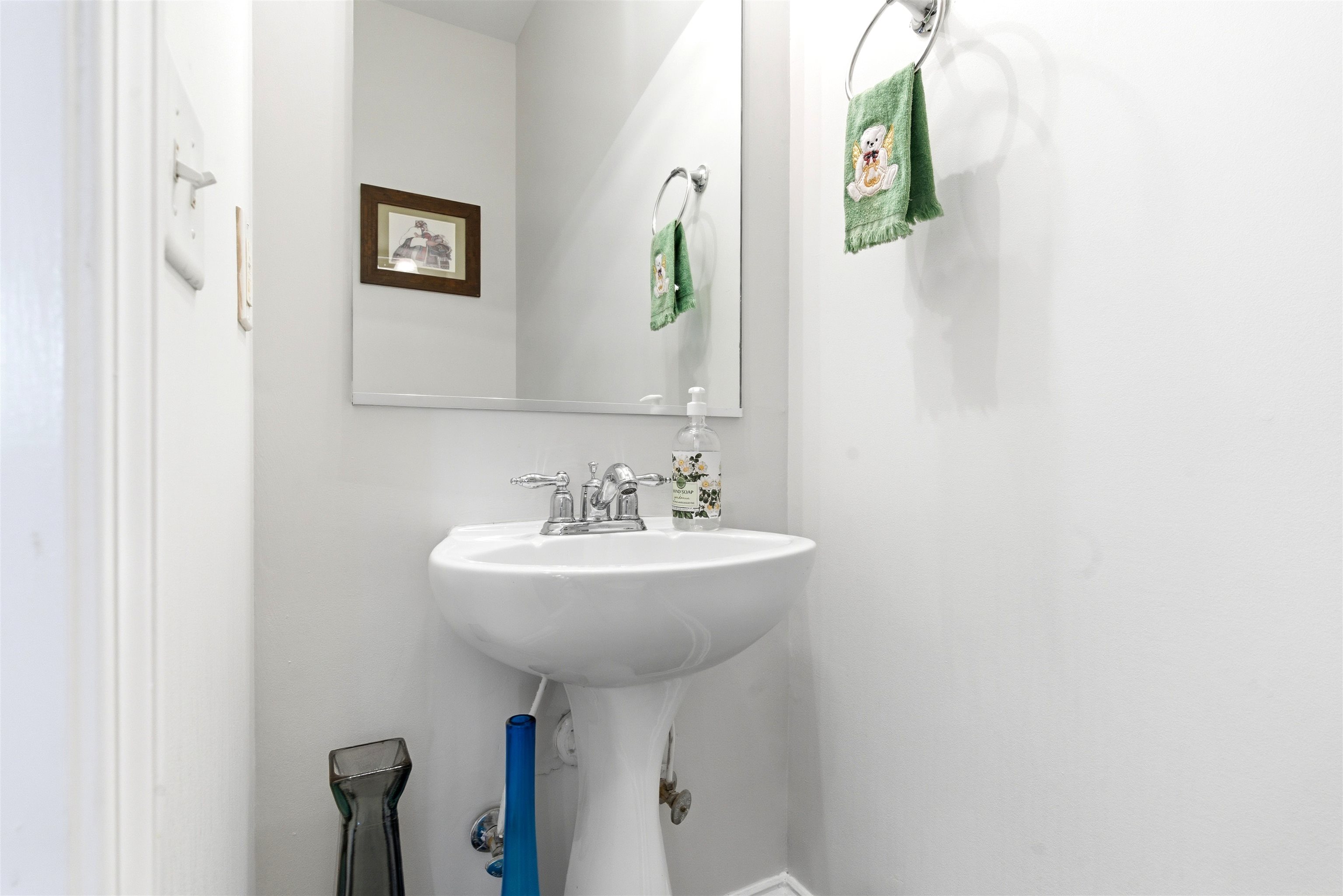 75 Shoemaker Court, Unit 105 Memphis, TN 38103 - Photo 16 of 36 a bathroom with a sink a mirror and a toilet