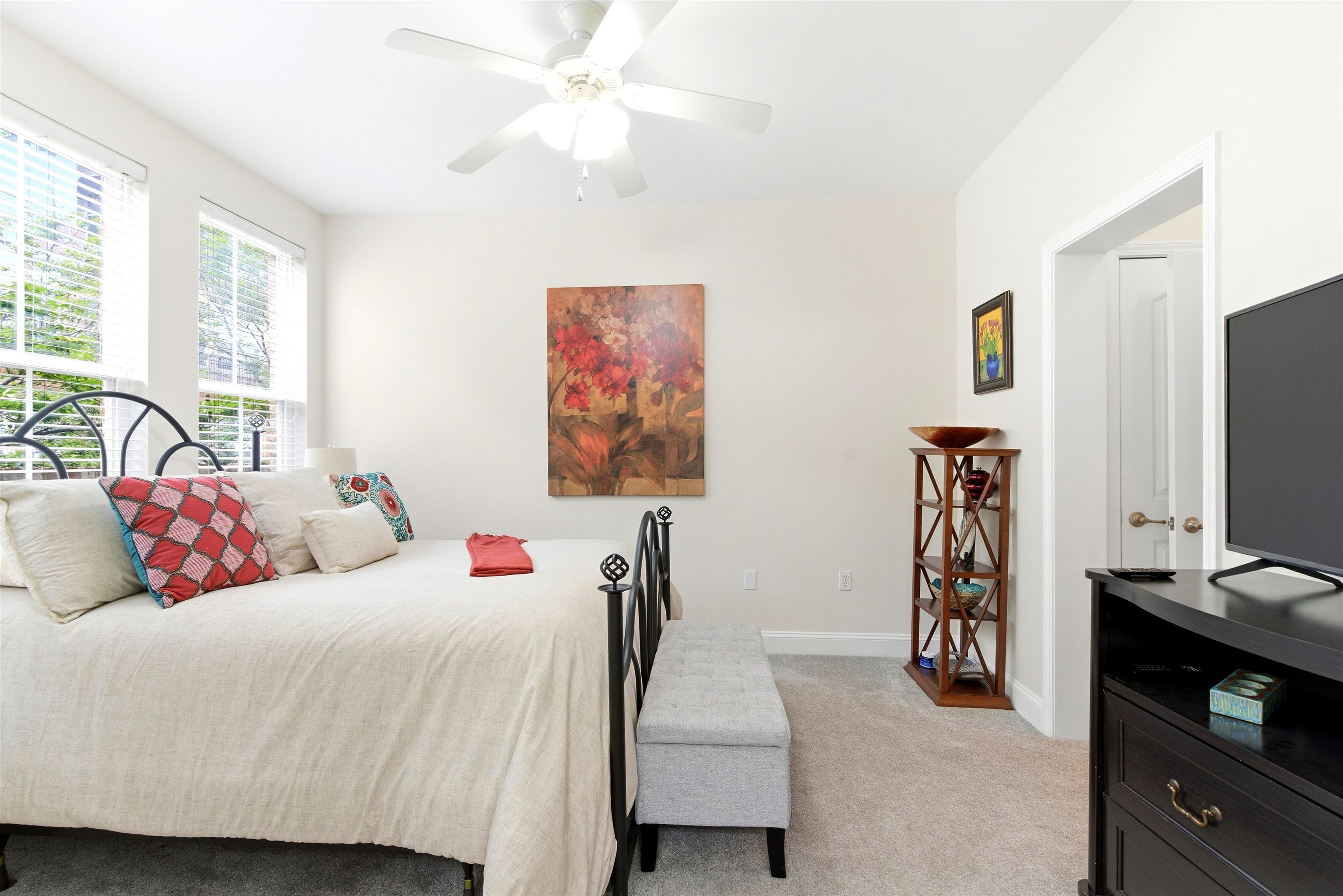 75 Shoemaker Court, Unit 105 Memphis, TN 38103 - Photo 18 of 36 a bedroom with a bed and a flat screen tv