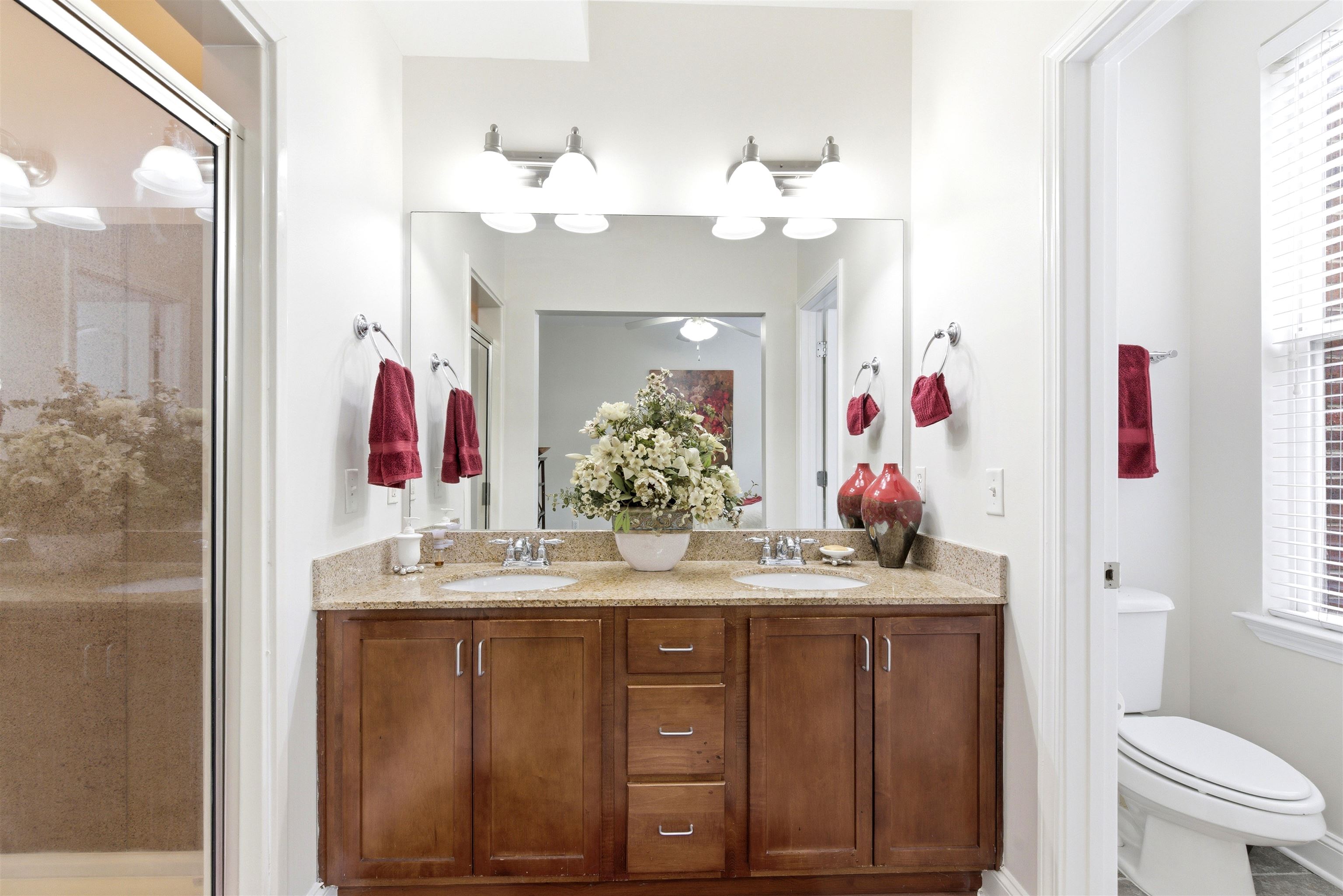 75 Shoemaker Court, Unit 105 Memphis, TN 38103 - Photo 20 of 36 a bathroom with a sink vanity and a mirror