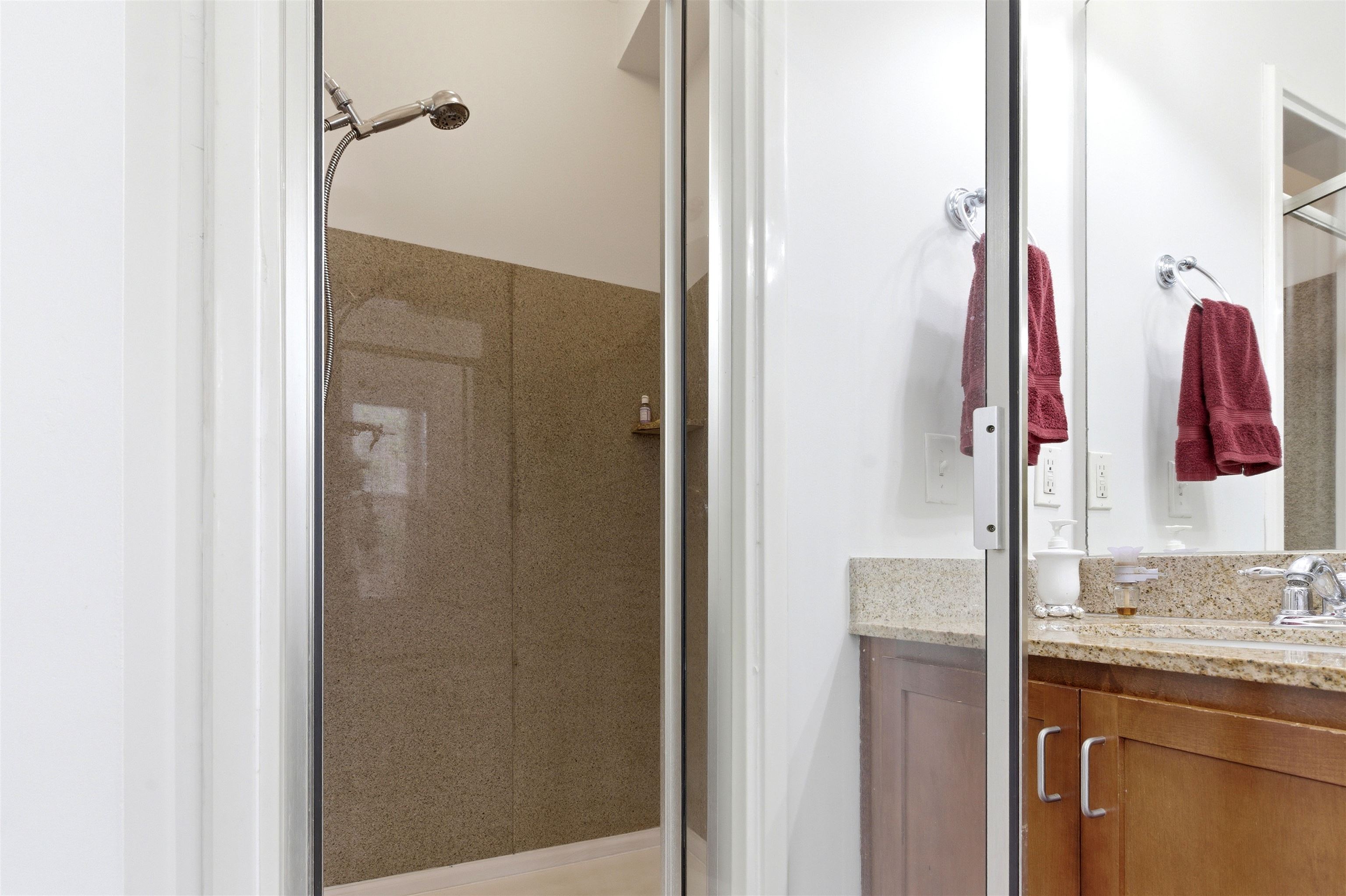 75 Shoemaker Court, Unit 105 Memphis, TN 38103 - Photo 22 of 36 a bathroom with a granite countertop shower and a sink