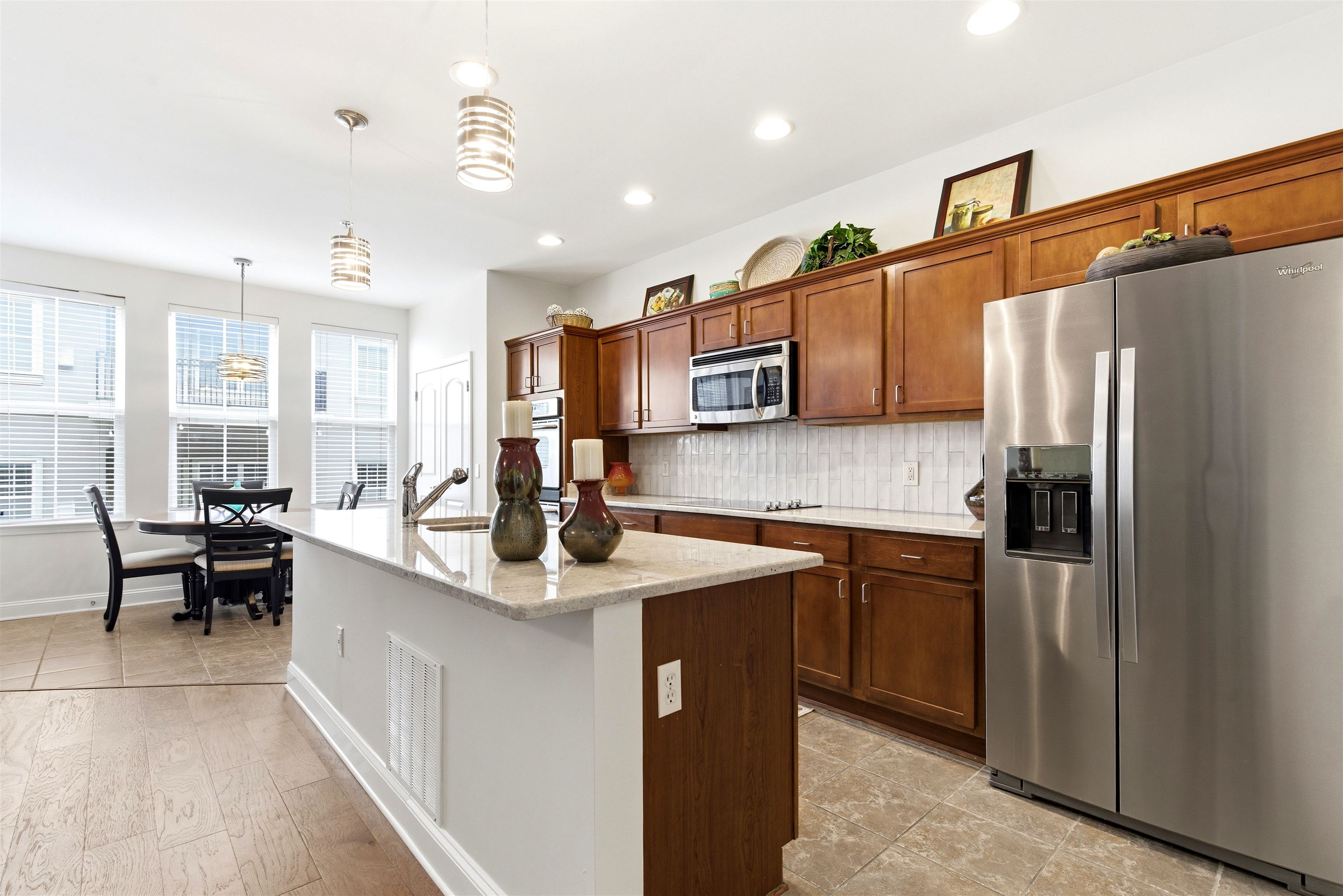 75 Shoemaker Court, Unit 105 Memphis, TN 38103 - Photo 29 of 36 a kitchen with stainless steel appliances granite countertop a sink a stove and a refrigerator