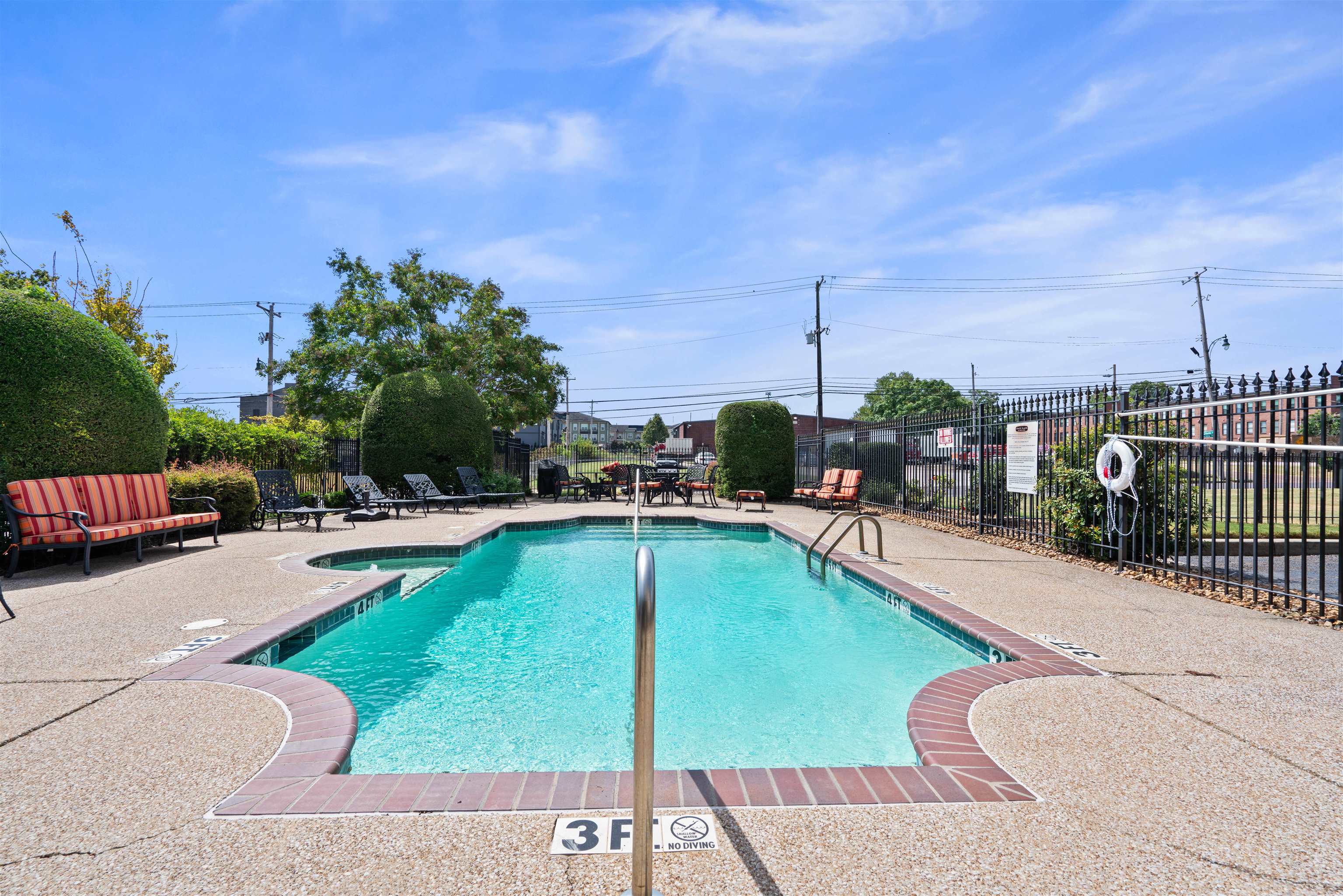 75 Shoemaker Court, Unit 105 Memphis, TN 38103 - Photo 34 of 36 a view of a swimming pool with a lounge chairs