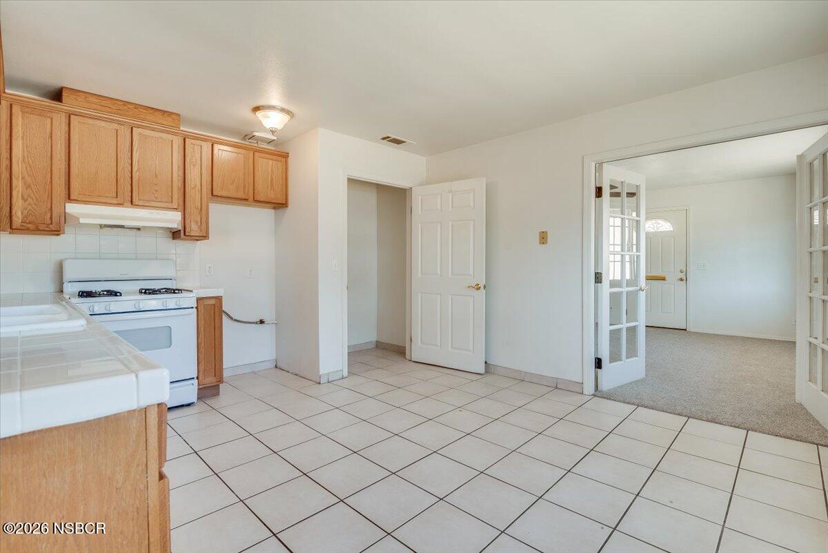 533 North G Street Lompoc, CA 93436 - Photo 16 of 32 a view of kitchen with stainless steel appliances granite countertop a refrigerator and a stove top oven