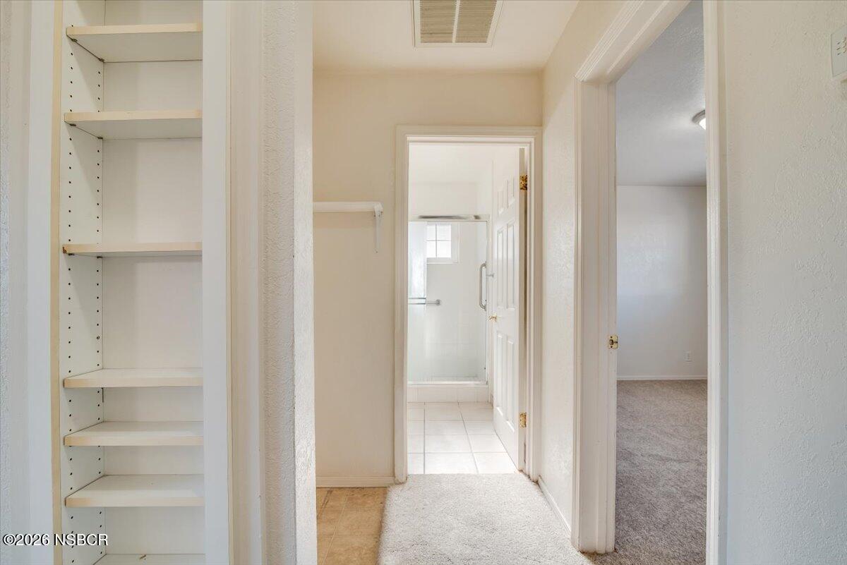 533 North G Street Lompoc, CA 93436 - Photo 18 of 32 a view of a bathroom from a hallway with toilet