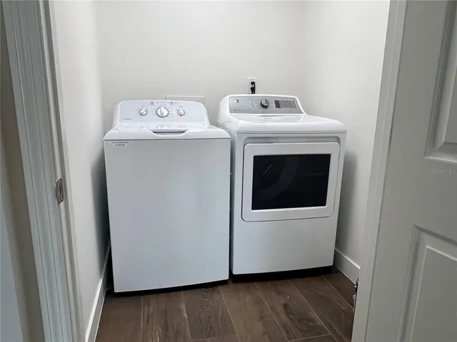 a utility room with dryer and washer