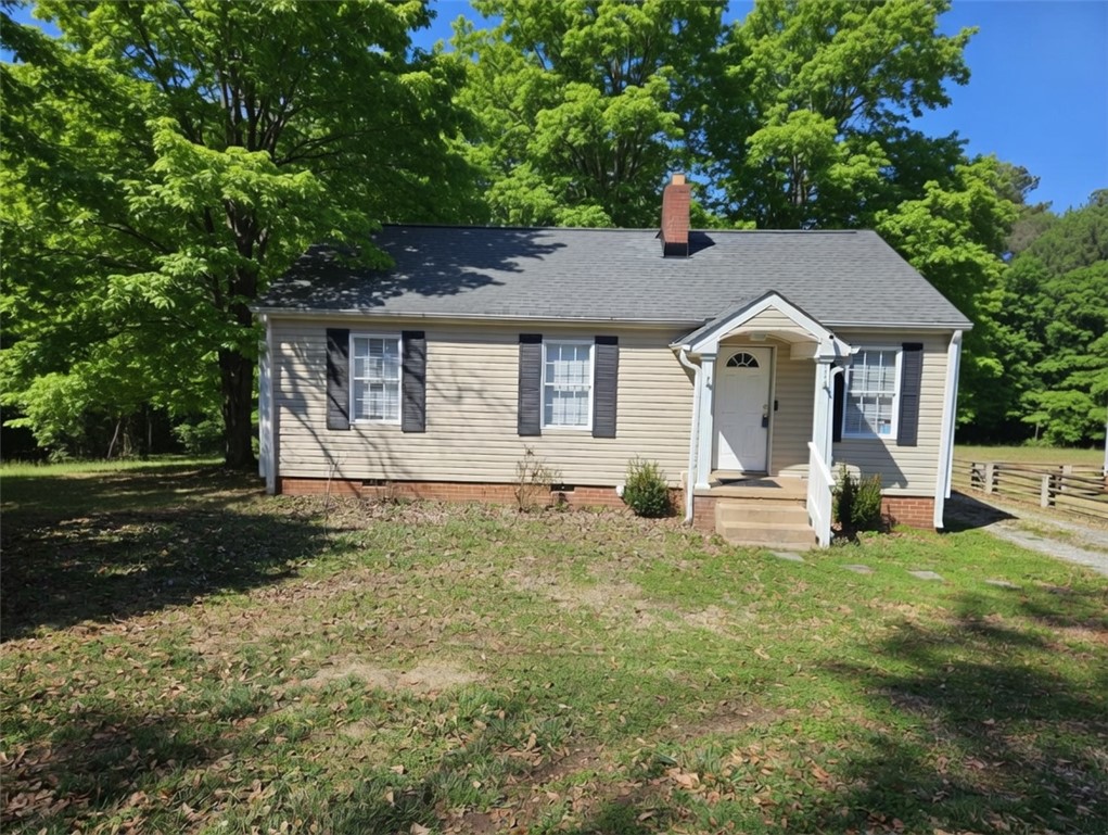 237 Pine Lane Anderson, SC 29621 - Photo 2 of 23 A charming single-story residence with a welcoming front entrance and vibrant surrounding greenery.