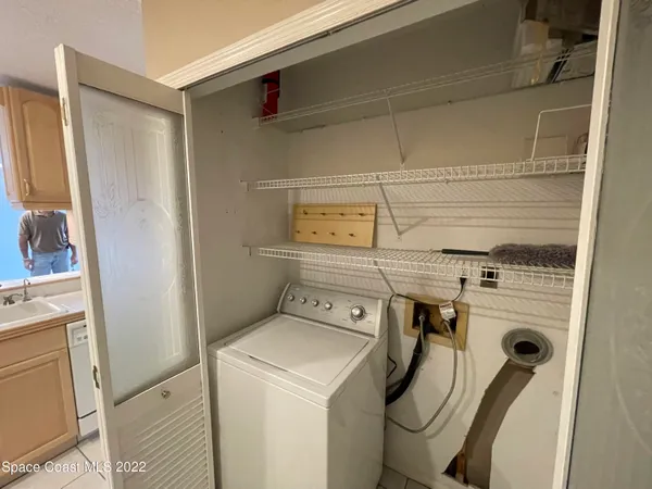 a spacious bathroom with a granite countertop sink a mirror and a shower