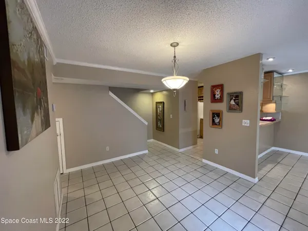 a white toilet sitting next to a shower