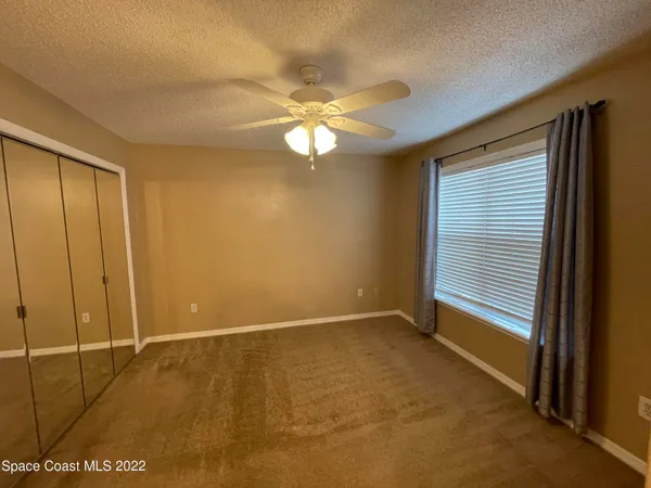 a view of a kitchen with a sink and cabinet area