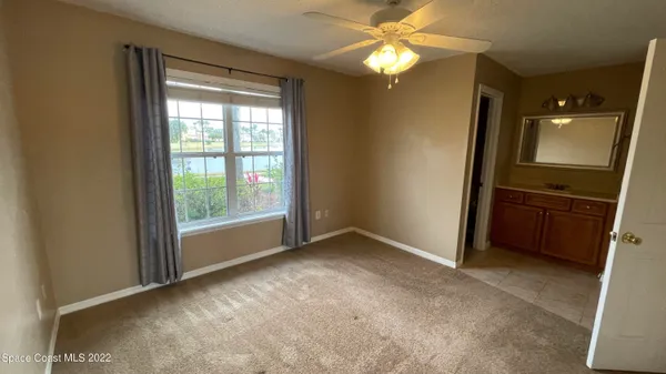 a bathroom with a sink vanity and mirror
