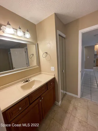 a kitchen with a sink cabinets and window