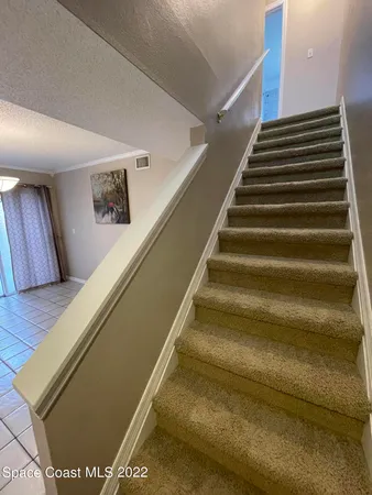 a bathroom with a sink toilet mirror vanity and shower