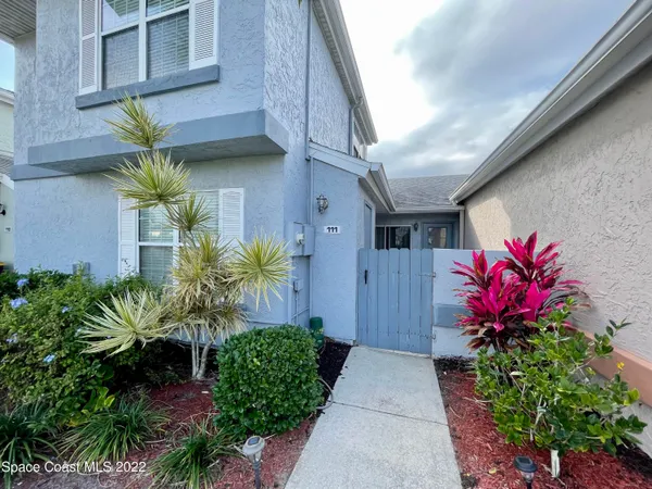 a house with a flower garden