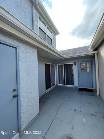 a house view with a garden space