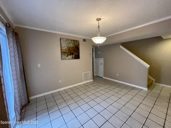 a kitchen with stainless steel appliances a refrigerator sink and microwave