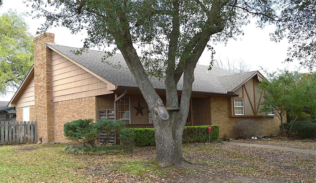 1012 Meridith Drive Terrell, TX 75160 - Photo 2 of 26 View of front of home featuring a shingled roof, brick siding, a chimney, and a porch