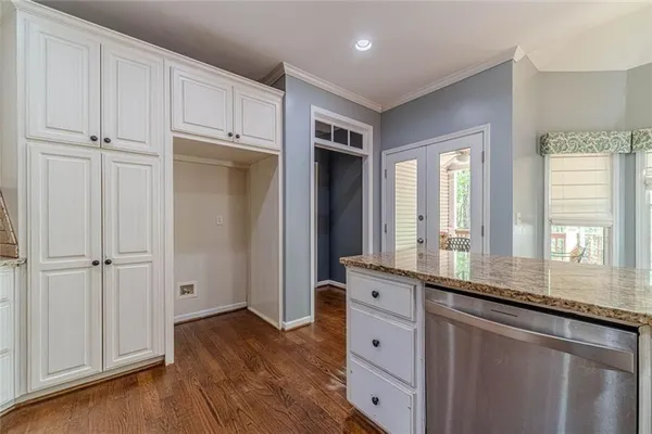 a bathroom with a tub a sink and mirror