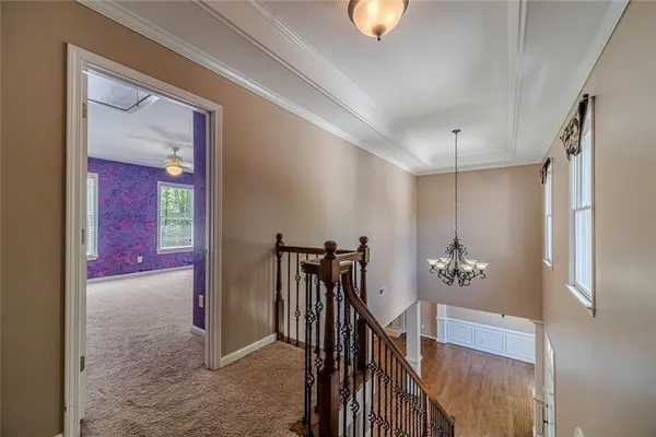 a view of an empty room with a ceiling fan