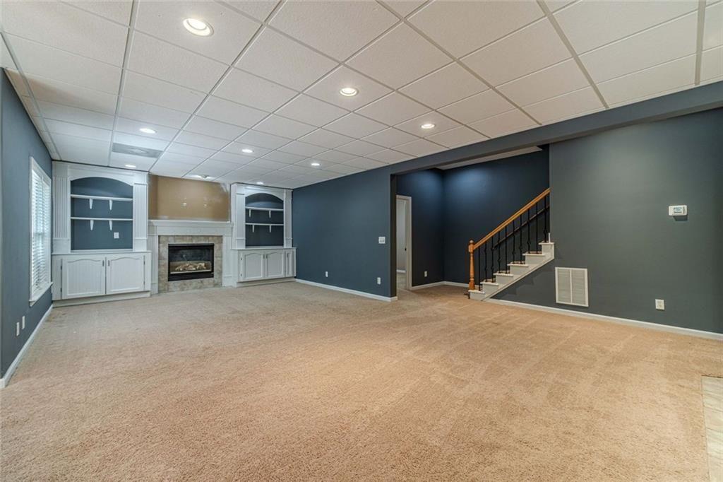 395 Amberbrook Circle Grayson, GA 30017 - Photo 36 of 70 a view of an empty room with a fireplace