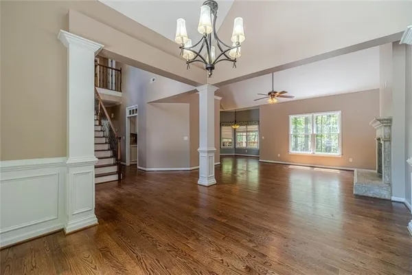 wooden floor fireplace and natural light in room