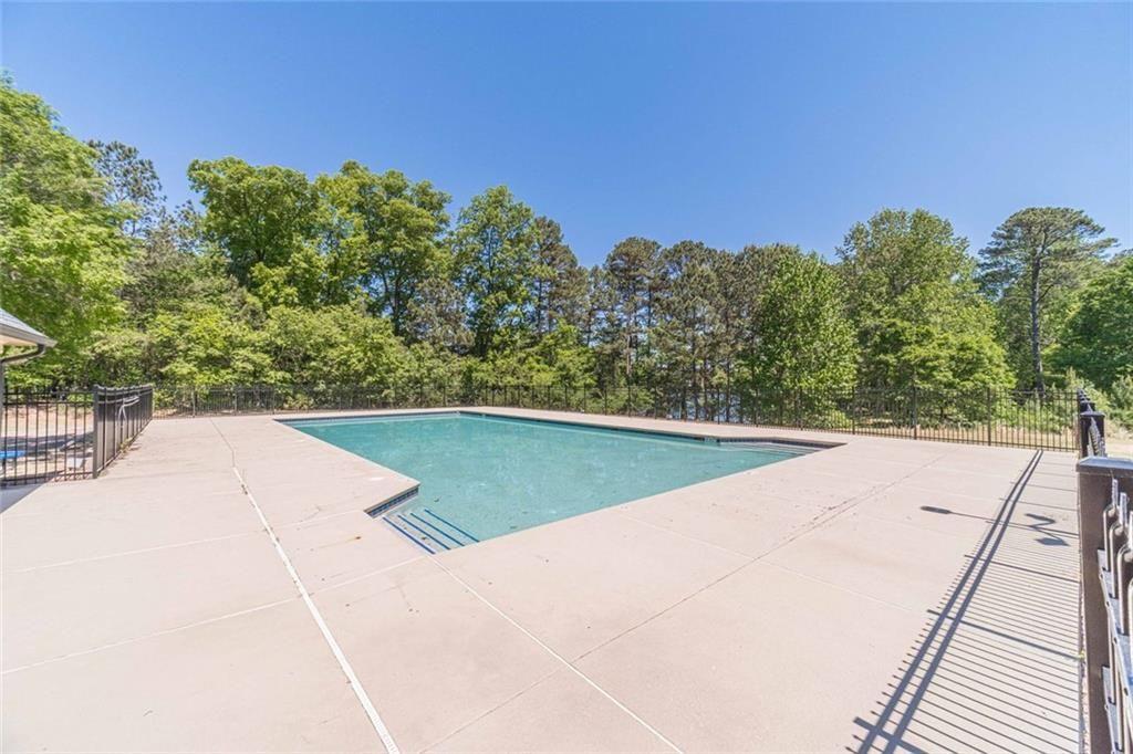 395 Amberbrook Circle Grayson, GA 30017 - Photo 65 of 70 a view of a swimming pool with an outdoor space