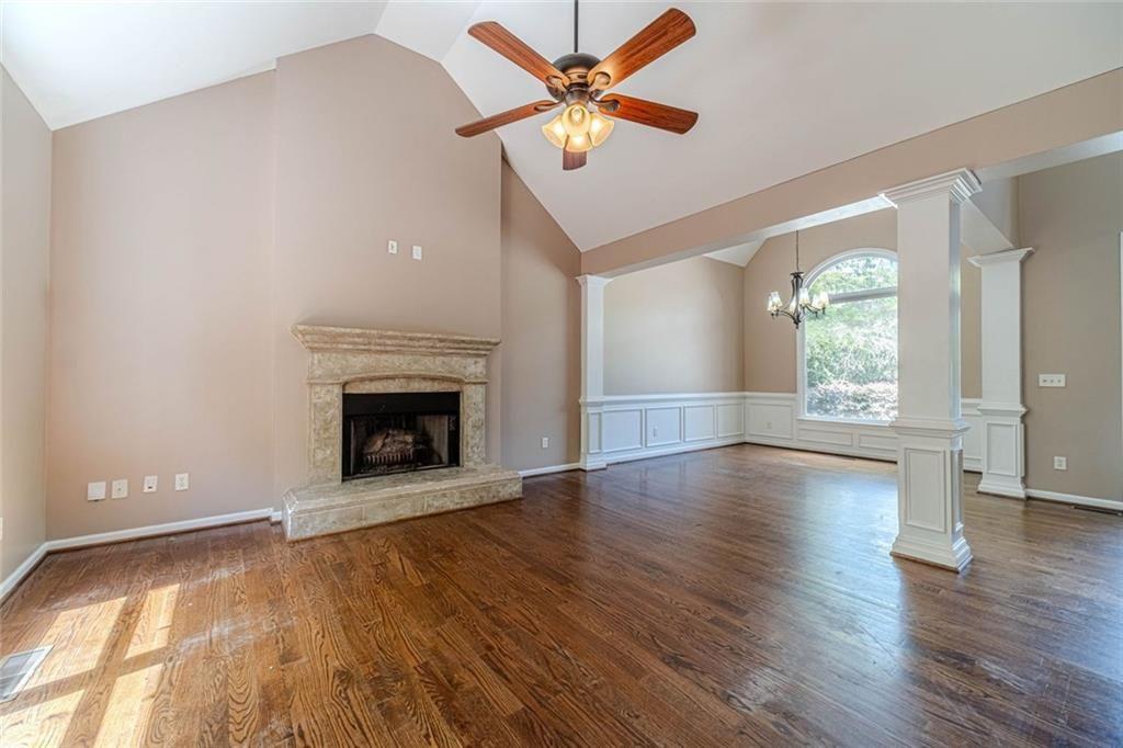 395 Amberbrook Circle Grayson, GA 30017 - Photo 7 of 70 a view of an empty room with window and wooden floor
