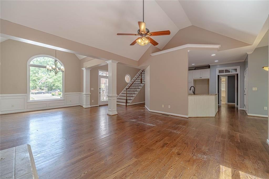 395 Amberbrook Circle Grayson, GA 30017 - Photo 9 of 70 a view of a livingroom with wooden floor and a ceiling fan