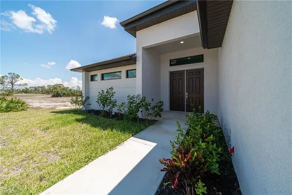 a front view of a house with garden