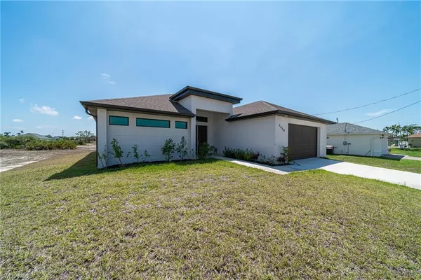 aerial view of a house with a yard
