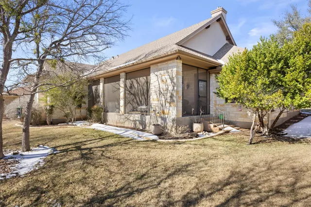 a front view of house with yard outdoor seating and barbeque oven