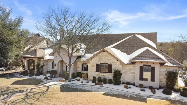 an aerial view of a house with swimming pool