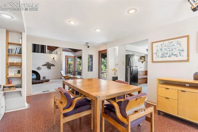 a kitchen with stainless steel appliances a sink window and cabinets