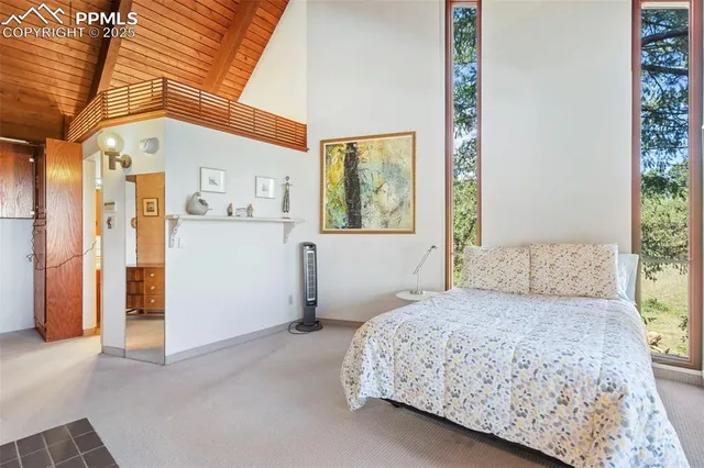 a bathroom with a double vanity sink a mirror and a shower