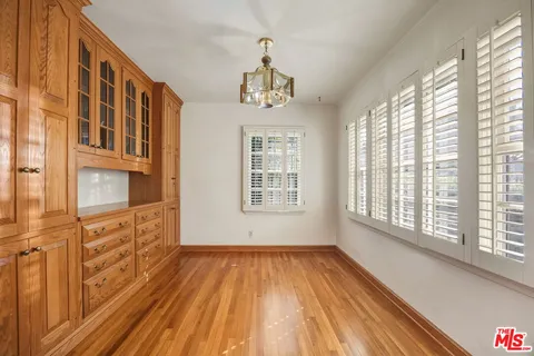 a view of an entryway with wooden floor