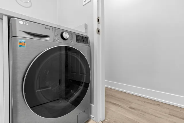 a utility room with washing machine