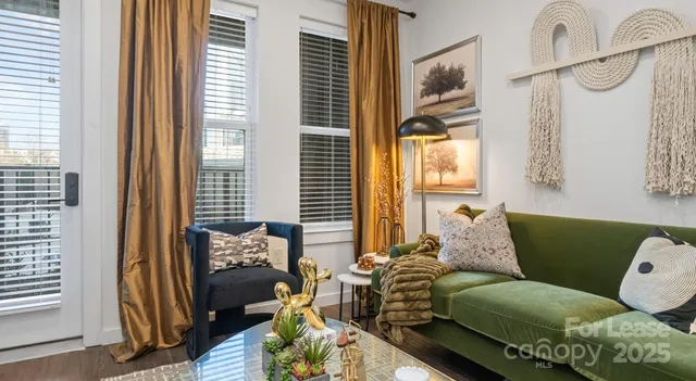 a large bedroom with bed and a night stand