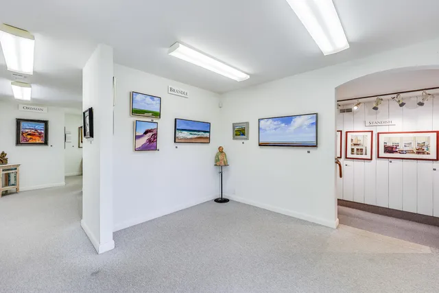 a view of a living room with furniture and storage
