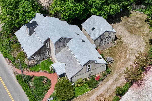 a picture of a room with a white wall and a painting