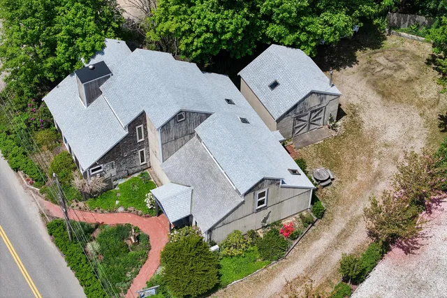 a picture of a room with a white wall and a painting