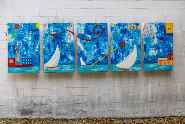 an aerial view of a houses with a yard