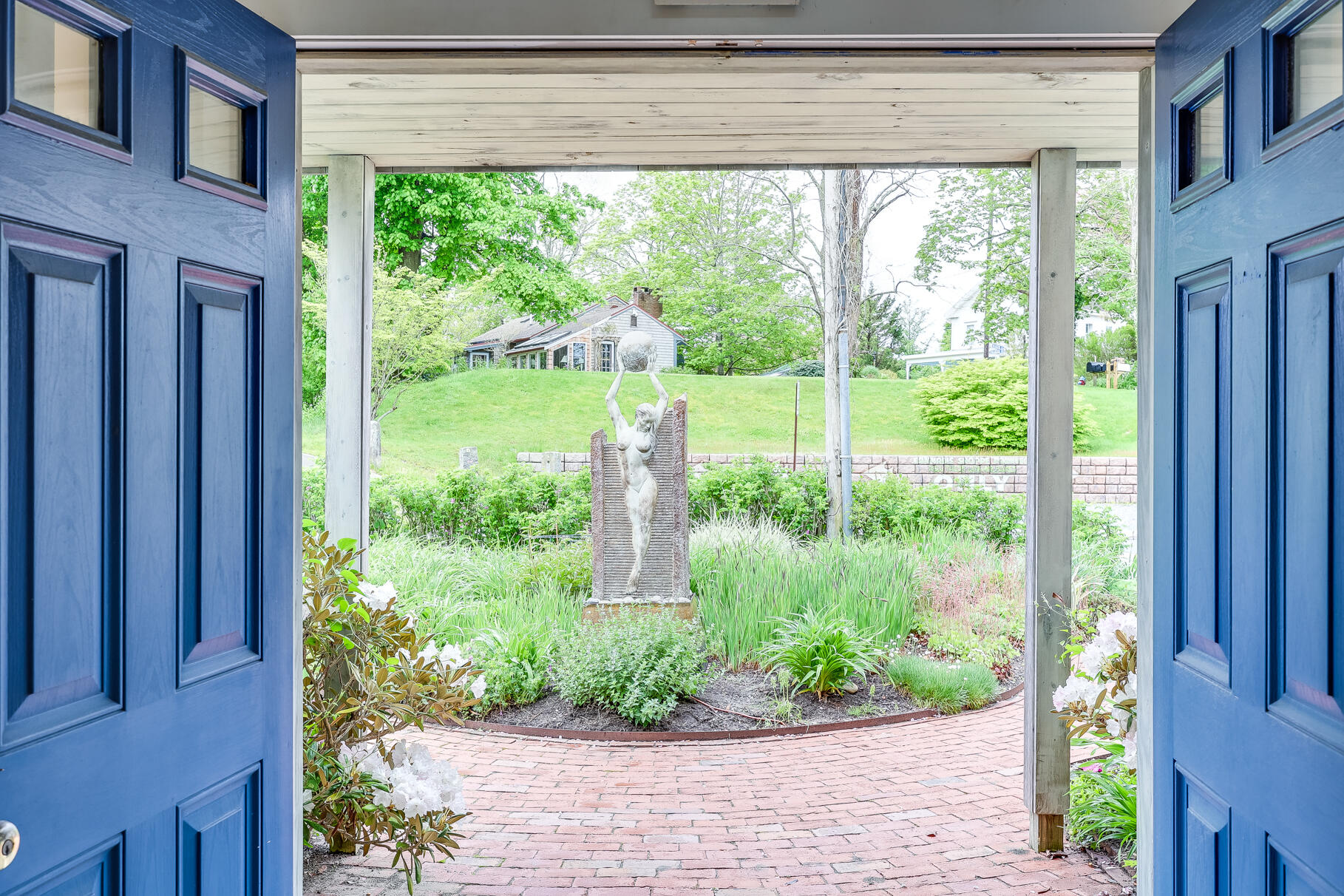 20 Bank Street Wellfleet, MA 02667 - Photo 4 of 49 a view of a garden from a windows