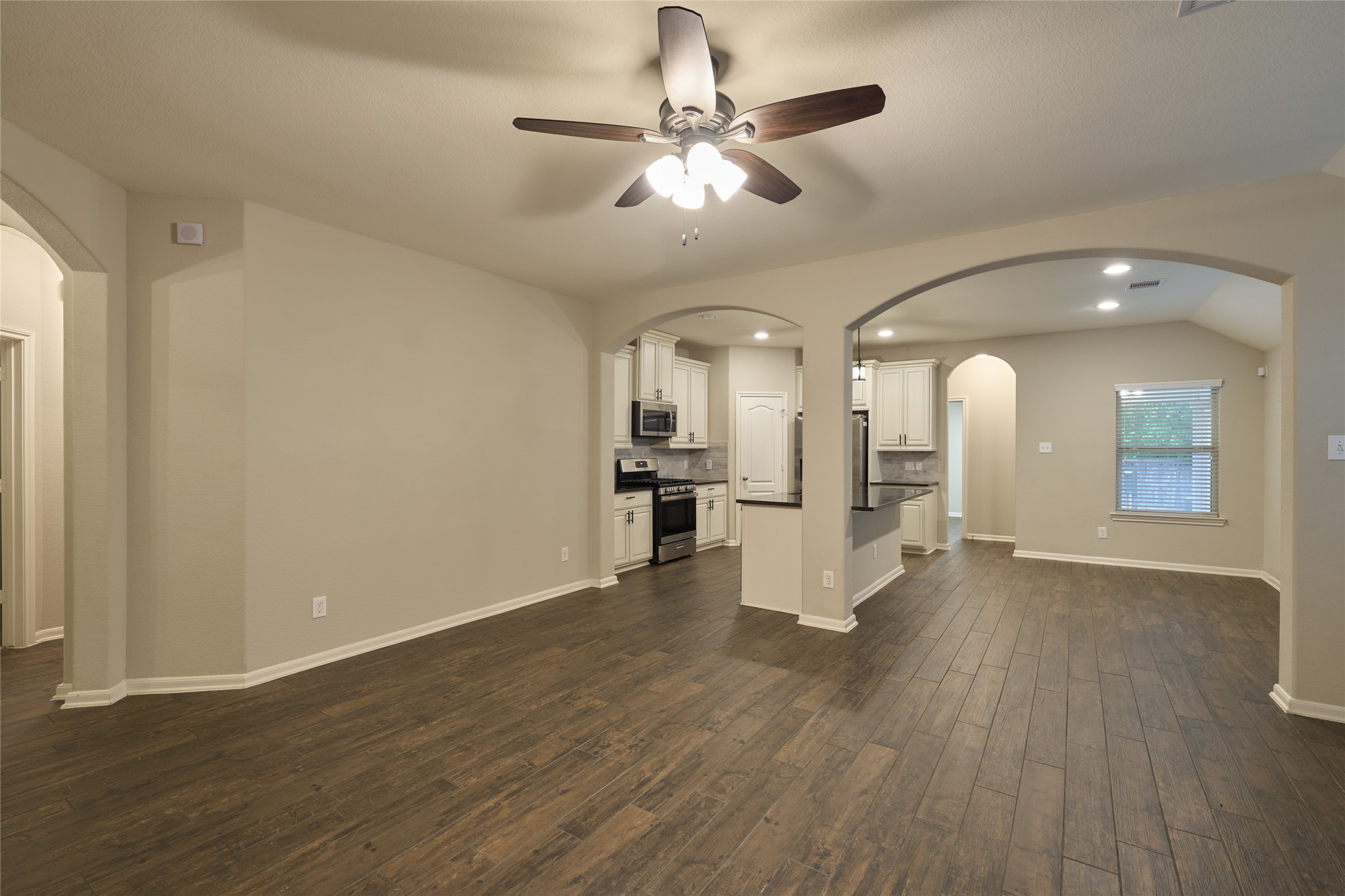 116 Fox Trail Road Montgomery, TX 77316 - Photo 15 of 50 View of the kitchen from the living area. Arches define different living spaces.