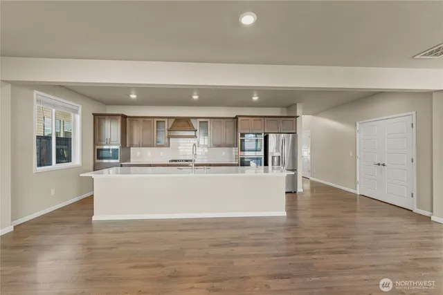 a view of kitchen with wooden floor