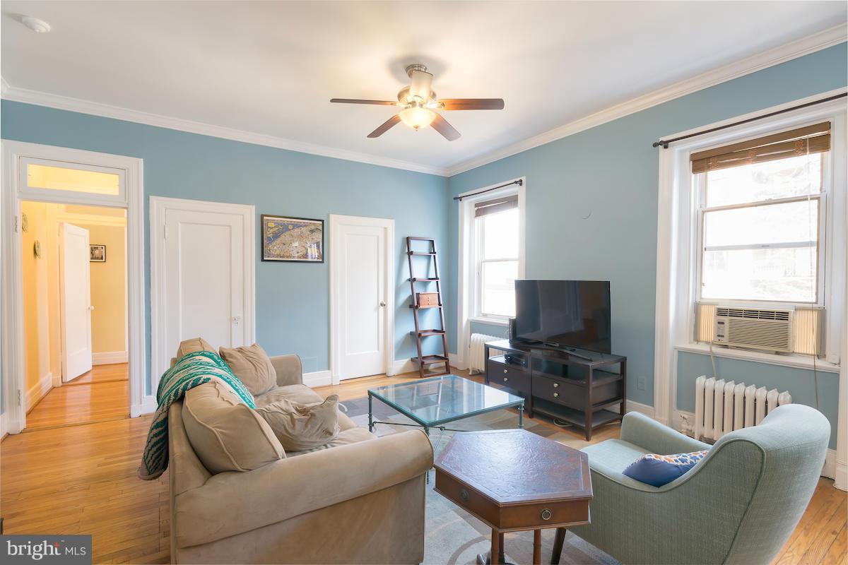 1734 P Street Northwest, Unit 46 Washington, DC 20036 - Photo 4 of 16 a living room with furniture and a flat screen tv