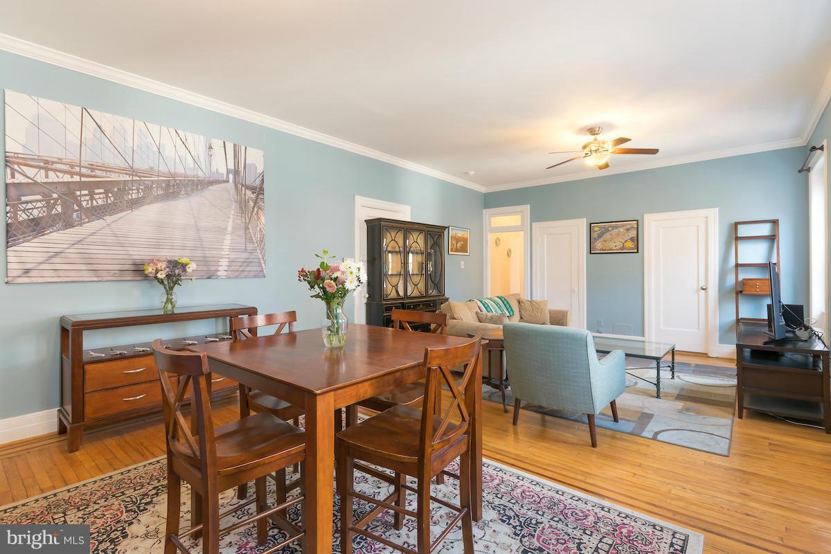 1734 P Street Northwest, Unit 46 Washington, DC 20036 - Photo 7 of 16 a view of a dining room with furniture and wooden floor
