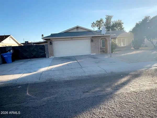 a front view of a house with a garage
