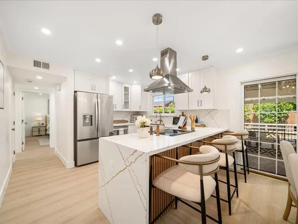 a kitchen with a sink and a window